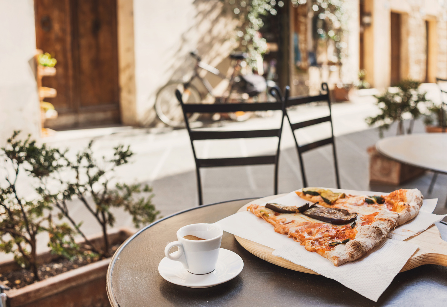 Vacations in Italy. Pizza and coffee in italian cafe